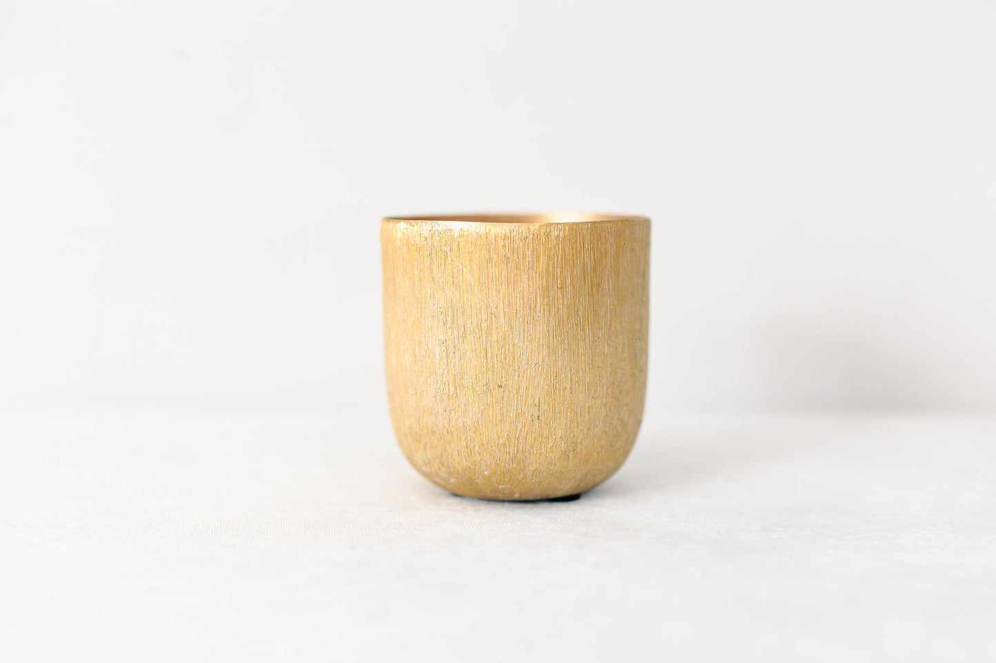 Gold vase on a white background