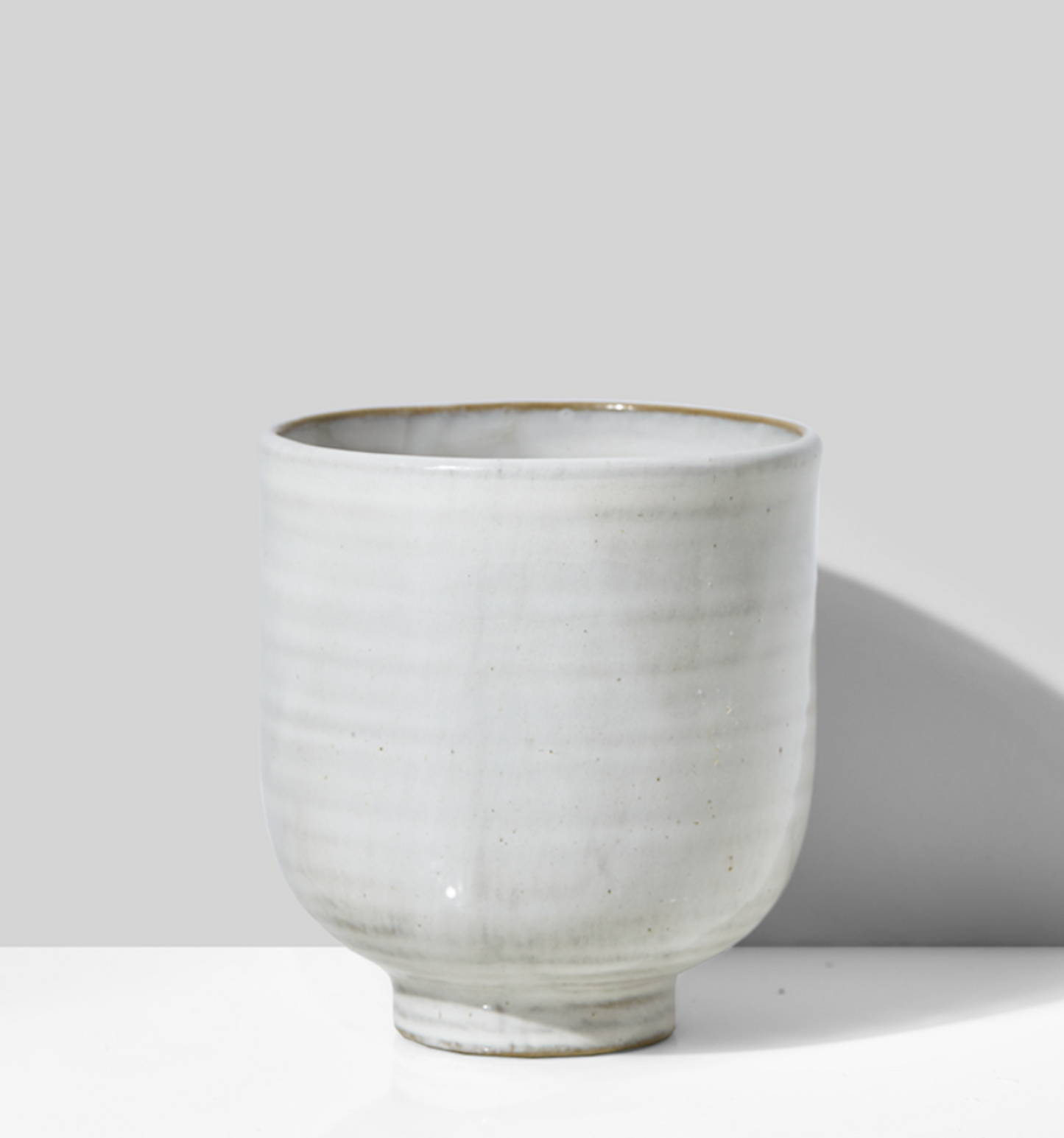 Small white vase or pot.