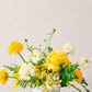 Yellow floral arrangement on a white background