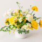 Yellow floral arrangement on a white background