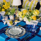 Decorative table setting with blue and yellow theme