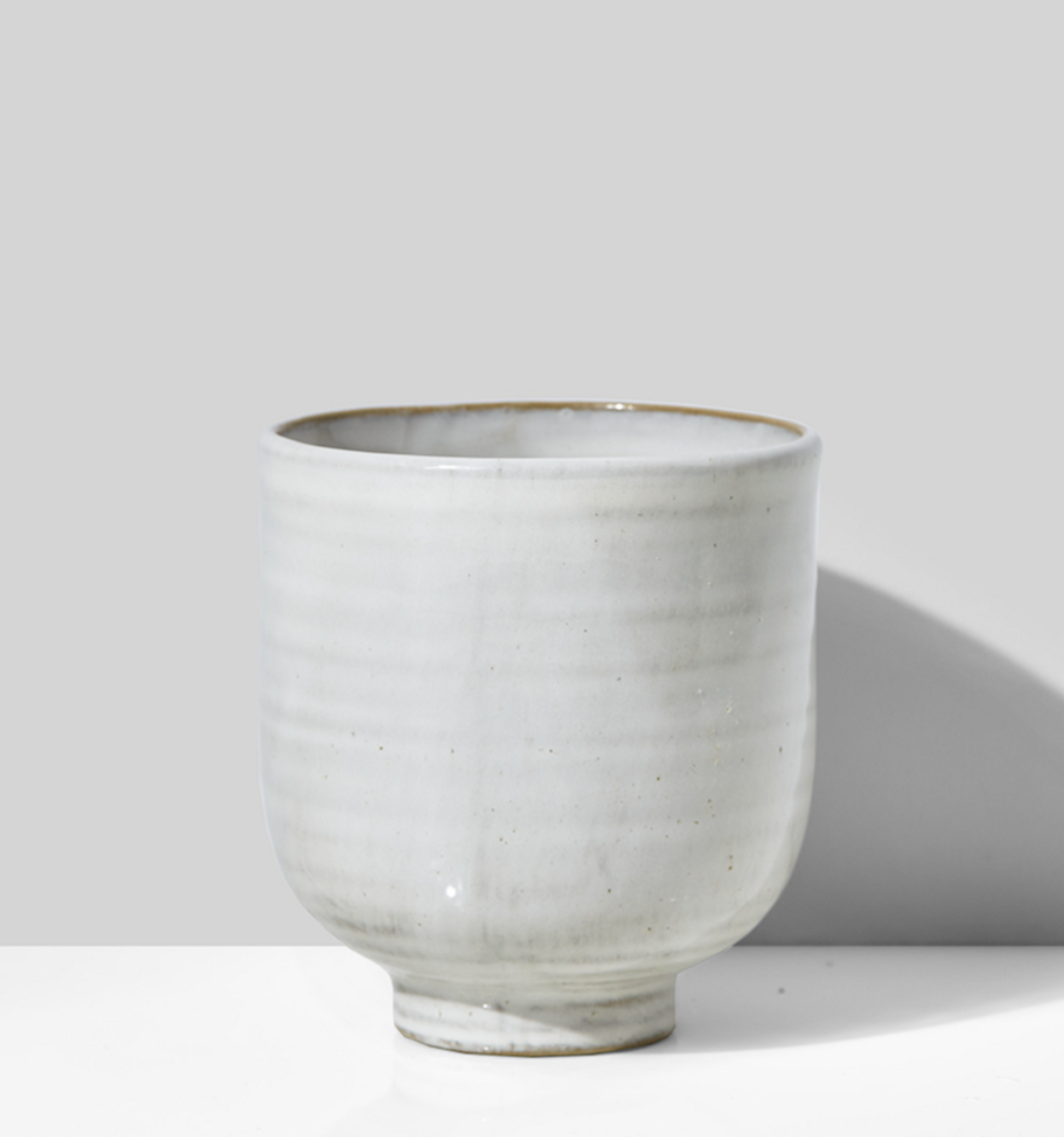 Small white vase or pot.